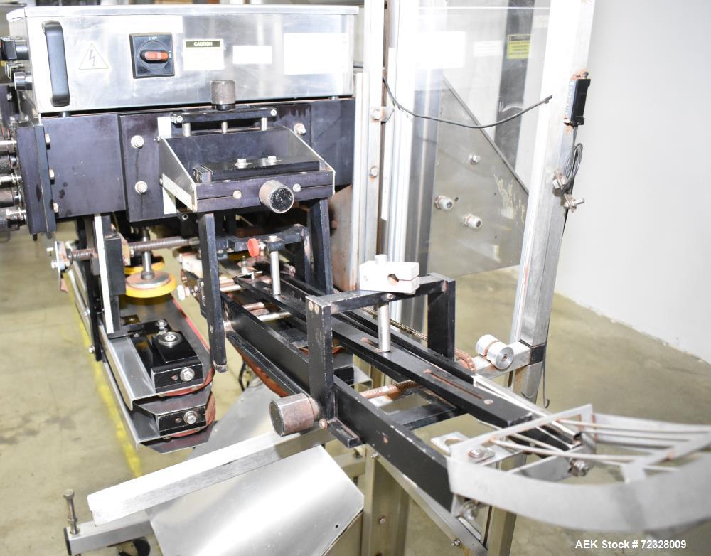 Used E-Pak Automatic Inline Quill Capper with Integrated Cap Elevator/Sorter.